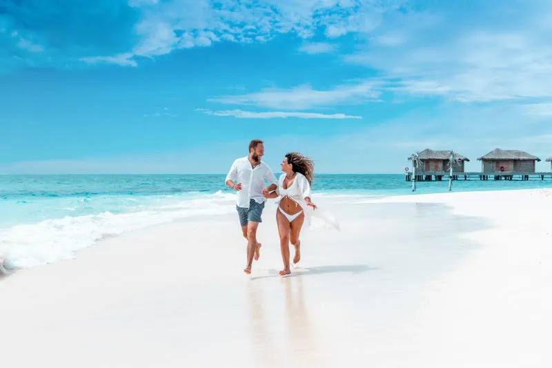 Honeymoon couple at an overwater villa in the Maldives